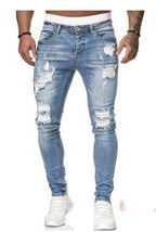 Ripped white denim trousers